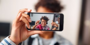 Person creating video content on a phone.