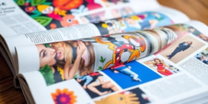 Creative magazine pages unfolding with vibrant imagery.